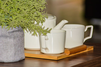 Close-up of tea cup on table at home