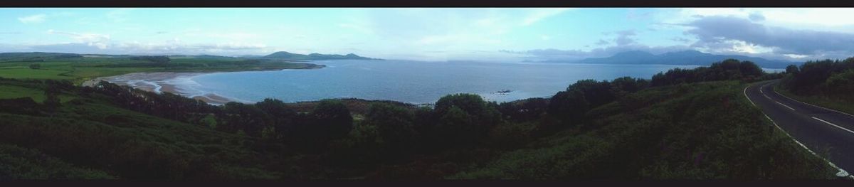 Scenic view of landscape against cloudy sky