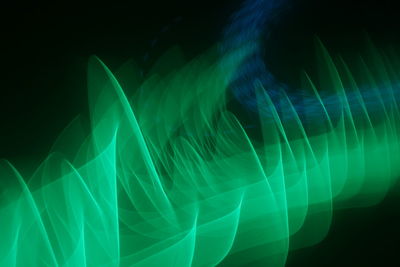 Close-up of light trails against black background