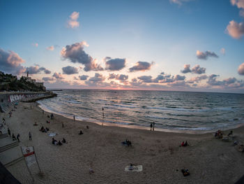 Scenic view of beach against sky during sunset