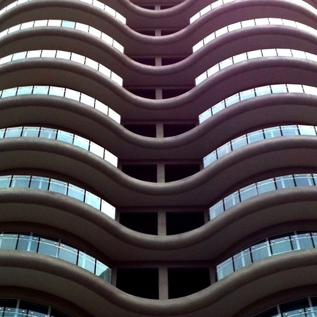 building exterior, architecture, built structure, city, modern, office building, window, skyscraper, building, apartment, tall - high, low angle view, glass - material, repetition, city life, full frame, tower, residential building, reflection, in a row