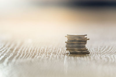 Close-up of coins on table