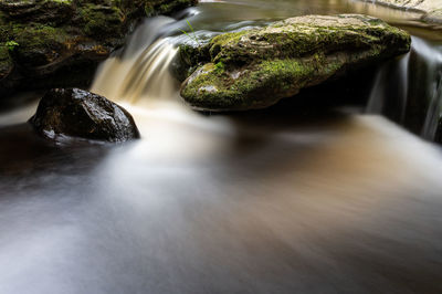 Close-up of water flowing through rocks