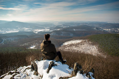 Man looking at mountain during winter