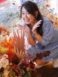 High angle view of young woman sitting on table