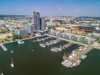 High angle view of buildings by sea against sky, aerial view on the port in gdynia, poland