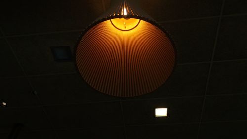 Low angle view of illuminated lamp