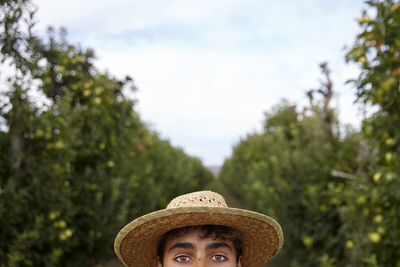 Kid portrait in the middle of an apple trees