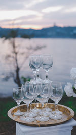 Wine glass at the lake at sunset