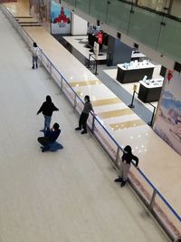 High angle view of people walking in corridor