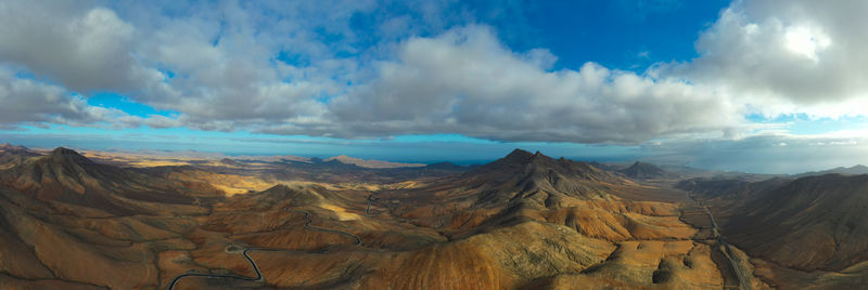 Panoramic view of mountains against sky