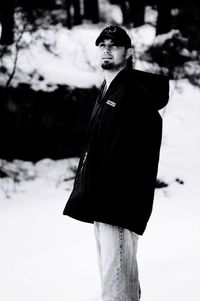 Portrait of young man standing in winter