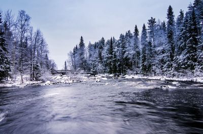 Scenic view of frozen lake against sky during winter