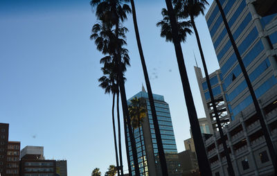 Low angle view of modern buildings against clear sky