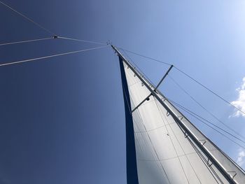 Low angle view of sailboat against clear sky