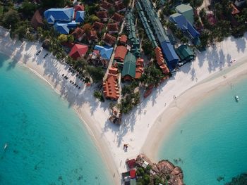 Aerial view of buildings by coastline