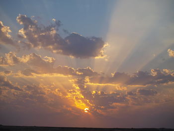 Low angle view of dramatic sky during sunset