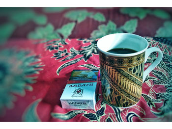 Close-up of coffee cup on table