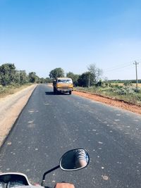 Car on road against clear sky