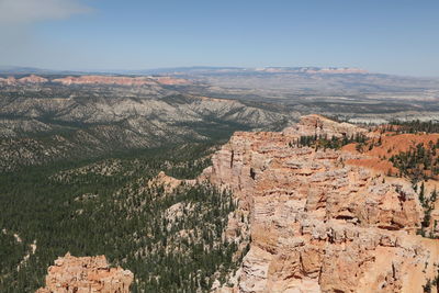 Aerial view of landscape with mountain range in background