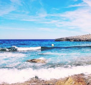 Scenic view of sea against blue sky