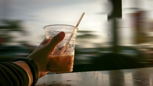 Close-up of hand holding drink