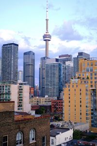 Buildings in city against sky