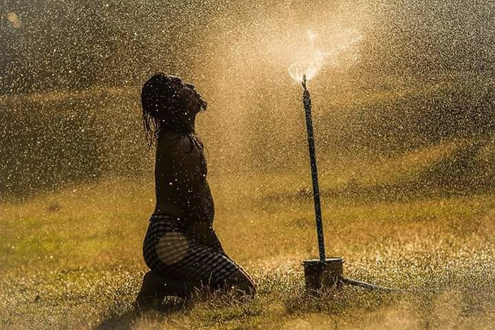 water, one person, outdoors, motion, full length, grass, people, spraying, nature, only women, adults only, one woman only, real people, adult, day, sky, young adult