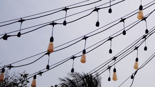 Low angle view of electricity pylon against sky