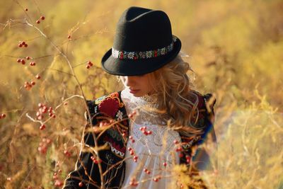 Woman wearing hat on field