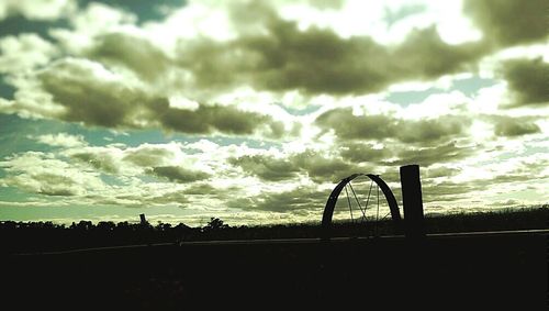 Scenic view of landscape against cloudy sky