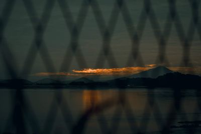 Blurred motion of lake against sky at night