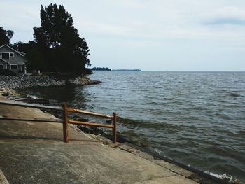 Scenic view of sea against cloudy sky