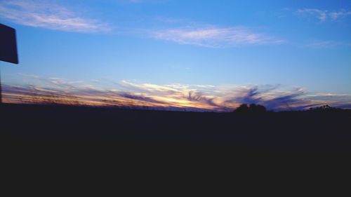 Scenic view of silhouette landscape against sky during sunset