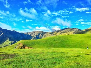 Scenic view of landscape against cloudy sky