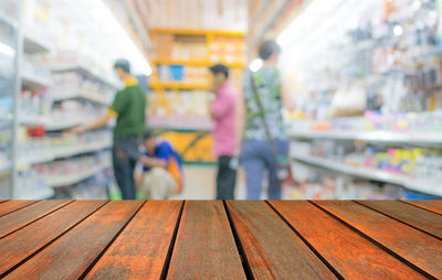 People walking in corridor of store