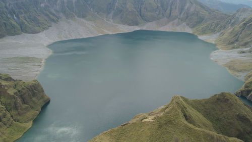 Crater lake of the volcano pinatubo among the mountains, philippines, luzon.