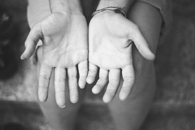 Cropped image of person showing palms