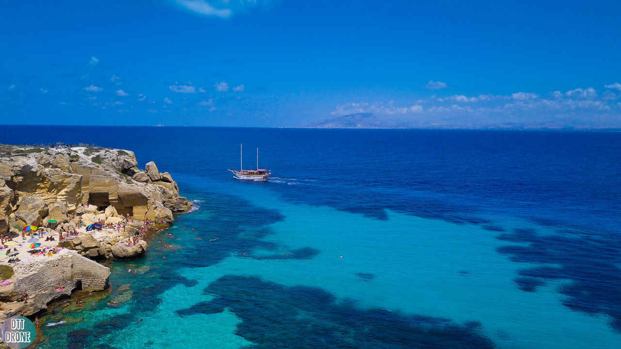 PANORAMIC VIEW OF SEA AGAINST BLUE SKY