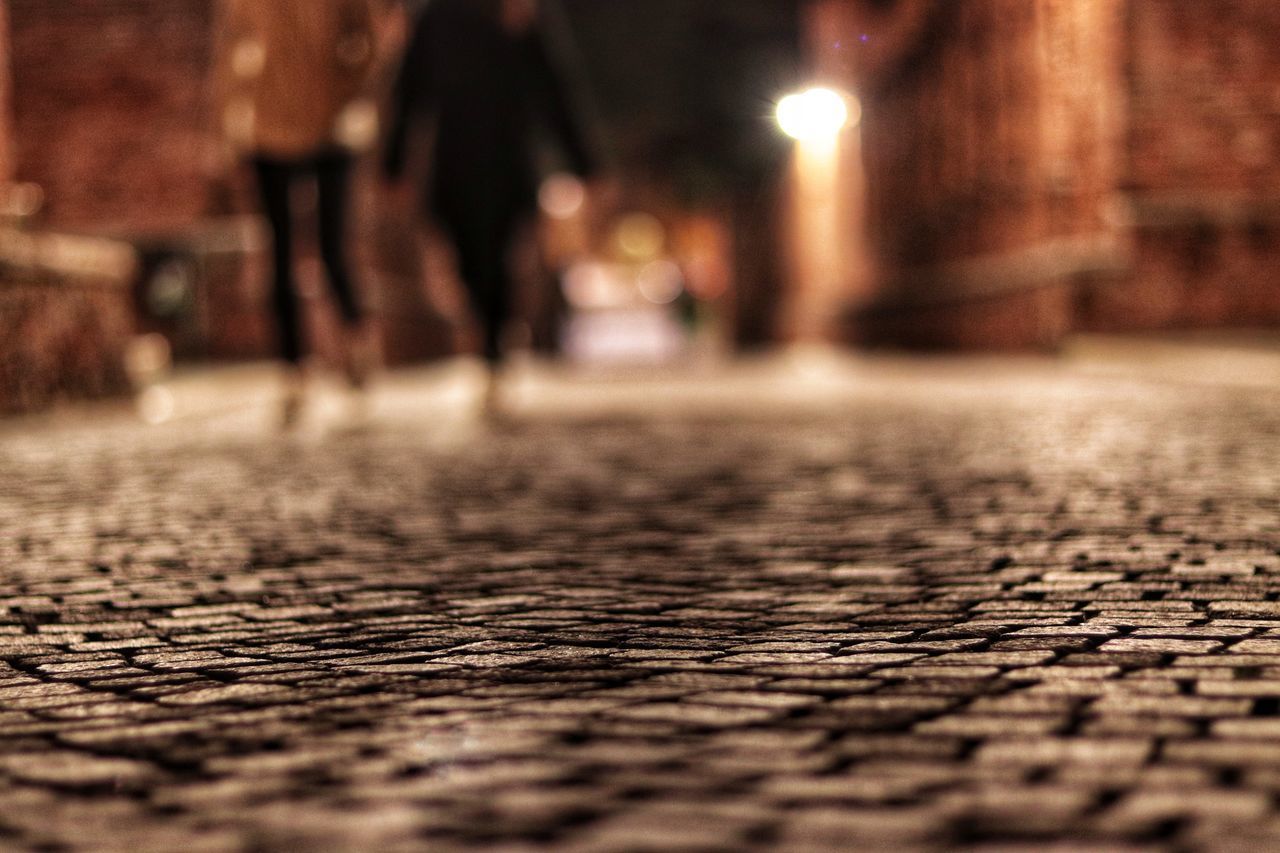 CLOSE-UP LOW SECTION OF PERSON ON GROUND