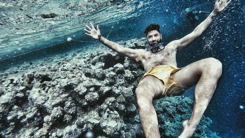 Portrait of man swimming undersea