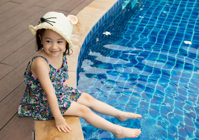 High angle view of cute girl at swimming pool