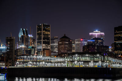 Illuminated buildings in city at night