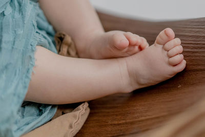 Low section of baby feet