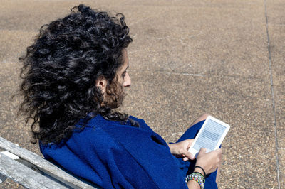 Side view of man using mobile phone