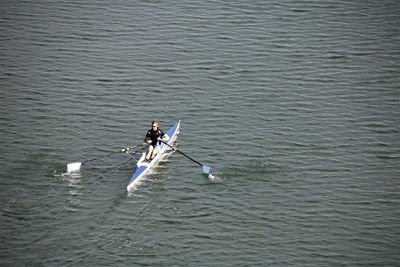 High angle view of people enjoying in sea