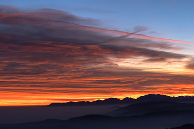 Scenic view of dramatic sky during sunset