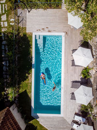 High angle view of swimming pool by building