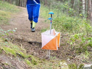 Rush sport people in forest checking chip with control point. selective focus