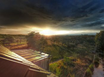 Scenic view of landscape against cloudy sky